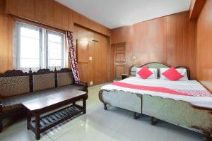 Postel nebo postele na pokoji v ubytování Hotel O Unique