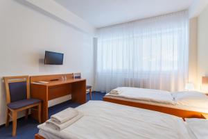 Postel nebo postele na pokoji v ubytování Hotel Veronika