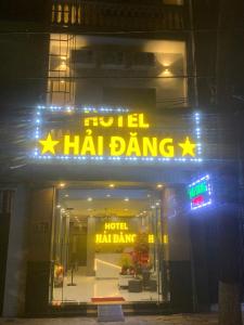 a hotel had dancing sign in front of a building at Hai Dang Hotel in Can Tho