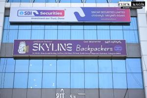 a sign on the side of a building at Skyline backpackers in Hyderabad