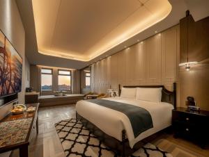 Postel nebo postele na pokoji v ubytování Xiamen Lujiang Harbourview Hotel