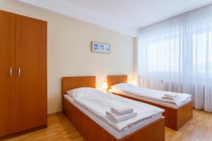 Postel nebo postele na pokoji v ubytování Hotel Veronika