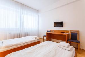 Postel nebo postele na pokoji v ubytování Hotel Veronika