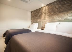 Postel nebo postele na pokoji v ubytování Hotel Gaden