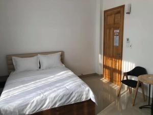 Postel nebo postele na pokoji v ubytování Hà Linh Hotel Vũng Tàu