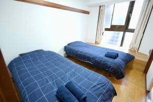 Postel nebo postele na pokoji v ubytování AMs house 5 min to Ikebukuro 13 min to Shinjuku Station 19 min to Shibuya Station + 17 fotografií