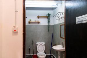 a bathroom with a toilet and a sink at Aru corner 6B1BR Tanjung aru town kota kinabalu in Kota Kinabalu +28 photos