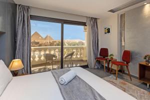 Voodi või voodid majutusasutuse Pyramids Yard Hotel toas