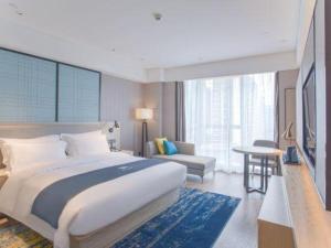 Postel nebo postele na pokoji v ubytování Echarm Hotel Nanning the MixC Dongmeng Business District + 238 fotografií