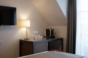 Postel nebo postele na pokoji v ubytování Hotel Des Alpes