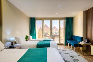 Voodi või voodid majutusasutuse Pyramids Yard Hotel toas