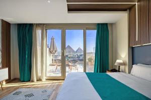 Voodi või voodid majutusasutuse Pyramids Yard Hotel toas