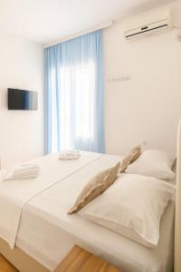 Postel nebo postele na pokoji v ubytování Apartments Hija