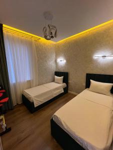 Postel nebo postele na pokoji v ubytování OS Shaumyana