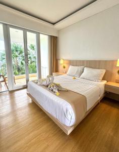 Postel nebo postele na pokoji v ubytování The Hita Apartement