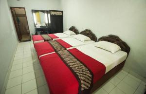 Postel nebo postele na pokoji v ubytování Hotel Batik Yogyakarta + 181 fotografií