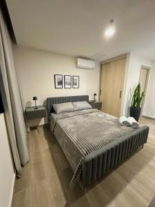 Postel nebo postele na pokoji v ubytování Cómodo y Lujoso Apartamento en Artemisa + 5 fotografií