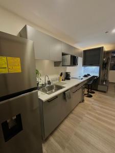 Nhà bếp/bếp nhỏ tại Cómodo y Lujoso Apartamento en Artemisa