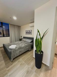 Postel nebo postele na pokoji v ubytování Cómodo y Lujoso Apartamento en Artemisa