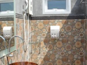 a bathroom with a sink and a window at Montana Cotswolds Resort in Ban Kom +157 photos