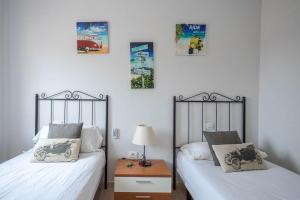 Ένα ή περισσότερα κρεβάτια σε δωμάτιο στο Lightbooking Esmeralda piscina privada Caleta de Fuste +22 φωτογραφίες