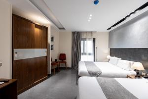 Voodi või voodid majutusasutuse Pyramids Yard Hotel toas