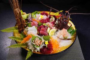 a plate of food with a salad on a table at 桐のかほり咲楽 in Kawazu