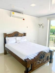 Postel nebo postele na pokoji v ubytování Hotel Pablo Jaraba Diaz