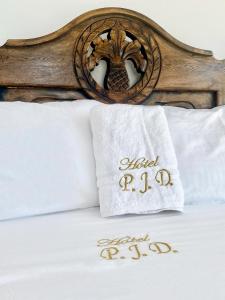 Postel nebo postele na pokoji v ubytování Hotel Pablo Jaraba Diaz