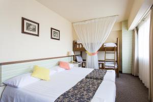 Postel nebo postele na pokoji v ubytování Hotel Francs