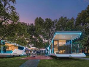 a house with a slide in the yard at New Century Grand Hotel Xuzhou in Xuzhou