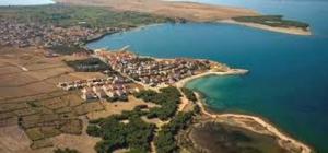 an island in the middle of a body of water at Nora Apartments in Povljana