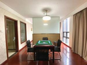 a conference room with a table and chairs in it at GreenTree Inn Hefei Huangshan Road Daxidi 1912 Express Hotel in Hefei