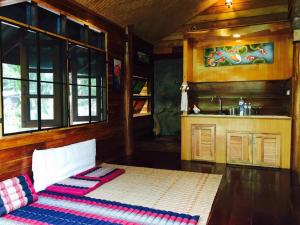 Postel nebo postele na pokoji v ubytování Chiang Dao Hut