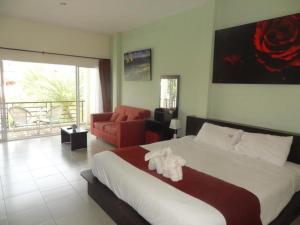 En eller flere senge i et værelse på Tulip Boutique Hotel