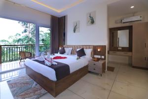 a bedroom with a large bed and a balcony at Evaara Resorts in Anachal +47 photos