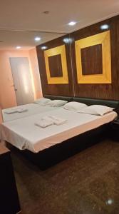Postel nebo postele na pokoji v ubytování Bermuda Hotel