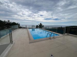Bazén v ubytování F2 Pamatai Nest - En hauteur, 10 min du centre ville - AC Wifi Piscine nebo v jeho okolí