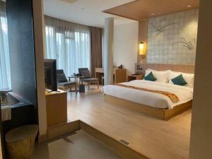 Postel nebo postele na pokoji v ubytování Shanghai Oyado Hotel