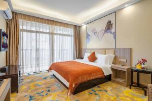 Postel nebo postele na pokoji v ubytování Oriental Hotel