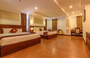 Ένα ή περισσότερα κρεβάτια σε δωμάτιο στο Ocean View Danang Hotel +98 φωτογραφίες