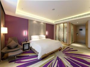 Ένα ή περισσότερα κρεβάτια σε δωμάτιο στο Lavande Hotel Deyang Guanghan +42 φωτογραφίες