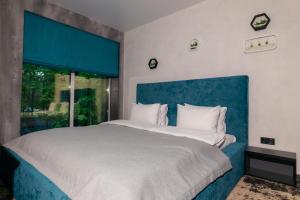 Posteľ alebo postele v izbe v ubytovaní Rado Hotel Spa