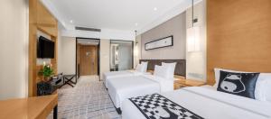 Voodi või voodid majutusasutuse Lyhn International Hotel Chengdu Taikoo Li toas