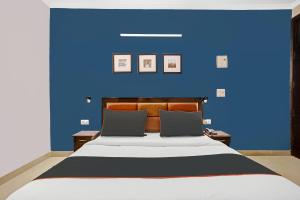 Postel nebo postele na pokoji v ubytování Super Collection O Agniv Residency Near Saket Metro + 35 fotografií