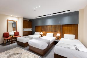 Voodi või voodid majutusasutuse Pyramids Yard Hotel toas