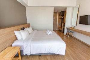 Ένα ή περισσότερα κρεβάτια σε δωμάτιο στο Chewa Khong Hotel Nakhon Phanom +34 φωτογραφίες