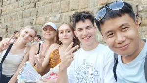 a group of people posing for a picture at Backpacker's Utopia Youth Hostel in Guangzhou