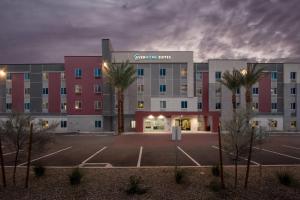 an empty parking lot in front of a hospital at Everhome Suites Chandler Phoenix Fashion Center in Chandler
