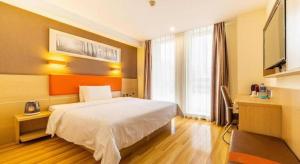 7 Days Premium Tangshan Railway Station Jiaotong University客房内的一张或多张床位